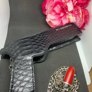 Gun shaped shoulder bag